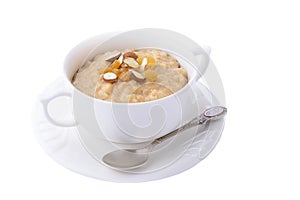 Oatmeal porridge with raisins on white background