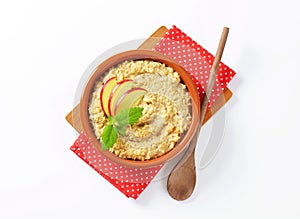 Oatmeal porridge with sliced apple