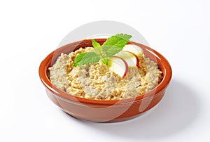 Oatmeal porridge with sliced apple