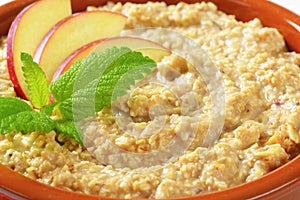 Oatmeal porridge with sliced apple