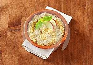 Oatmeal porridge with sliced apple