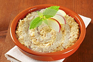 Oatmeal porridge with sliced apple