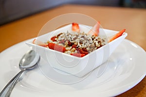 Oatmeal with Strawberries and Nuts with Spoon