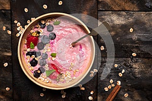 Oatmeal with walnuts, strawberries and blueberries