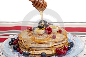 Oats and banana pancakes with berries