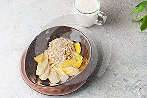 Oats Barley Wheat Rye Corn mix flake proper nutrition diet with pieces banana orange and glass of milk