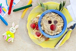 Oats porridge with raspberries as a reindeer for kids