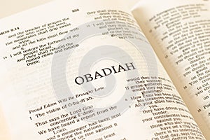 Obadiah prophet open Holy Bible Book on white background. A close-up