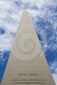 The Obelisco de Buenos Aires against a blue sky photo