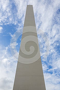 The Obelisco de Buenos Aires against a blue sky photo