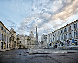Obelisk and Church of St. Trophime on Place de la Republique in Arles, France photo