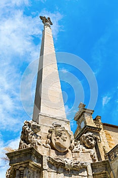 Obelisk in front of the Eglise de la Madeleine in Aix en Provence photo