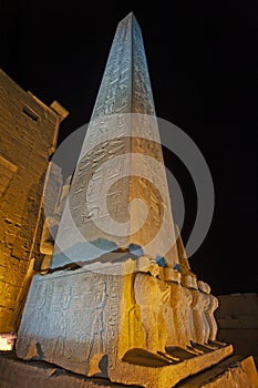 Obelisk with hieroglyphics at ancient egyptian Luxor Temple in night