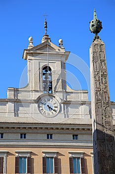 Obelisk of Montecitorio and Italian parliament on Piazza di Mont photo