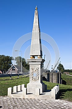 Obelisk near dutch sluice Dokkumer Nieuwe Zijlen