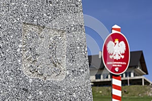 The obelisk and a Polish crest on Trojmezi point, the border between Czech Republic, Slovakia and Poland