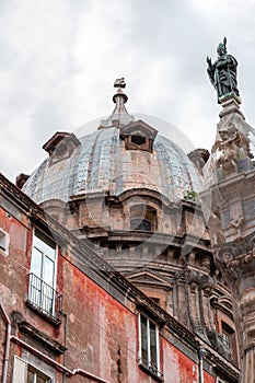 The obelisk of San Gennaro and the cupola of the chapel of San Gennaro in the historical centre of Naples, Italy photo