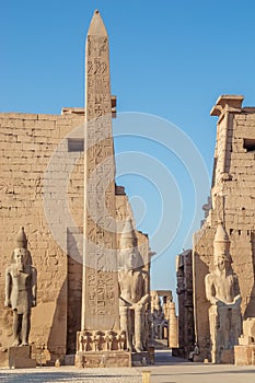 The obelisk and the statues of Ramesses II