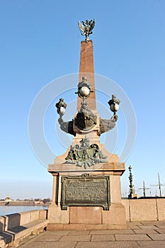 The obelisk on the Troitsky bridge over the Neva river