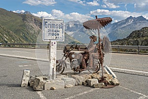 Metal sculpture of a pair of bikers the top of the Grimsel Pass, Canton of Valais, Switzerland