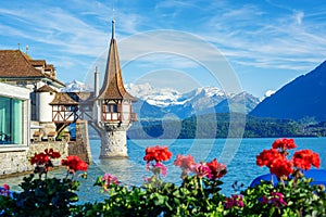 Oberhofen castle on Lake Thun, Switzerland, Alps mountains photo