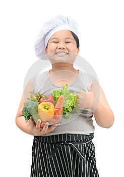 Obese boy chef smaile and like to eat vegetables