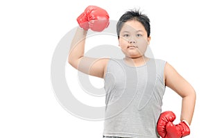 Obese boy show muscle with red boxing gloves isolated