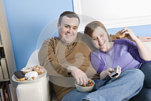 Obese Couple Sitting Together