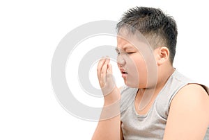 Obese fat boy checking his breath with his hand isolated