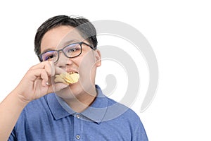 Obese fat boy eating potato chips isolated on white background