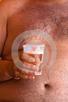 Obese man with beer
