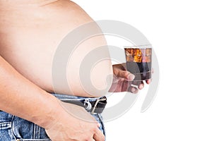 Obese man with big belly holding a glass of fizzy soda