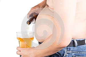 Obese man with big belly pouring a glass of refreshing beer