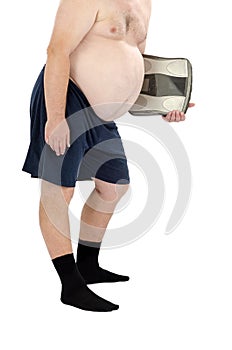 Obese man in the black socks with scales