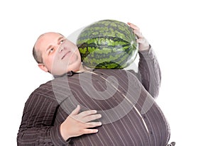 Obese man carrying a watermelon