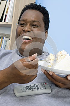 Obese Man Eating Cake