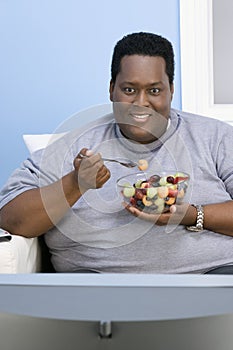 Obese Man Eating Fruits