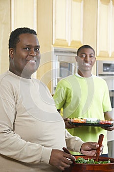 Obese Man Preparing Salad