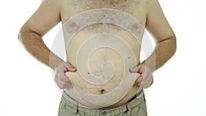 Obese man squeezing fat stomach