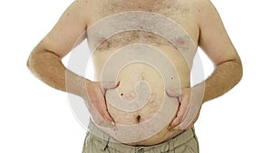 Obese man squeezing fat stomach