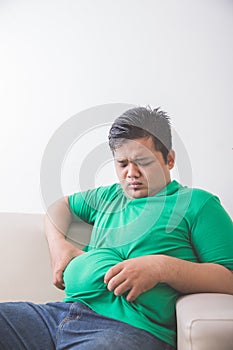 Obese man thinking about his weight problem