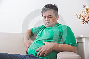 Obese man thinking about his weight problem