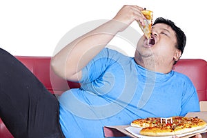 Obese person eats pizza 2