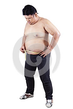 Obese person measuring his belly 3