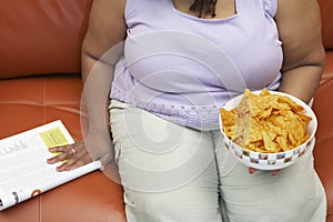 Obese Woman With A Bowl Of Nachos