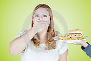 Obese woman closed mouth for fast food