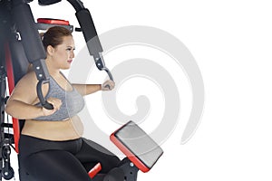 Obese woman exercising with press machine