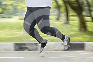 Obese woman feet running on the road