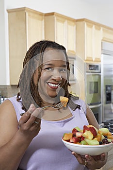 Obese Woman Having Fruit Salad