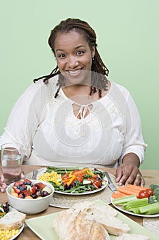 An Obese Woman Holding Glass Of Water